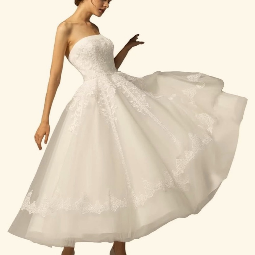 Bridal strapless tea length wedding dress.  Never worn NWT